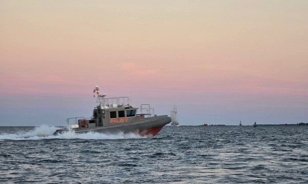 Pilot boat underway in Charleston Harbor at sunset