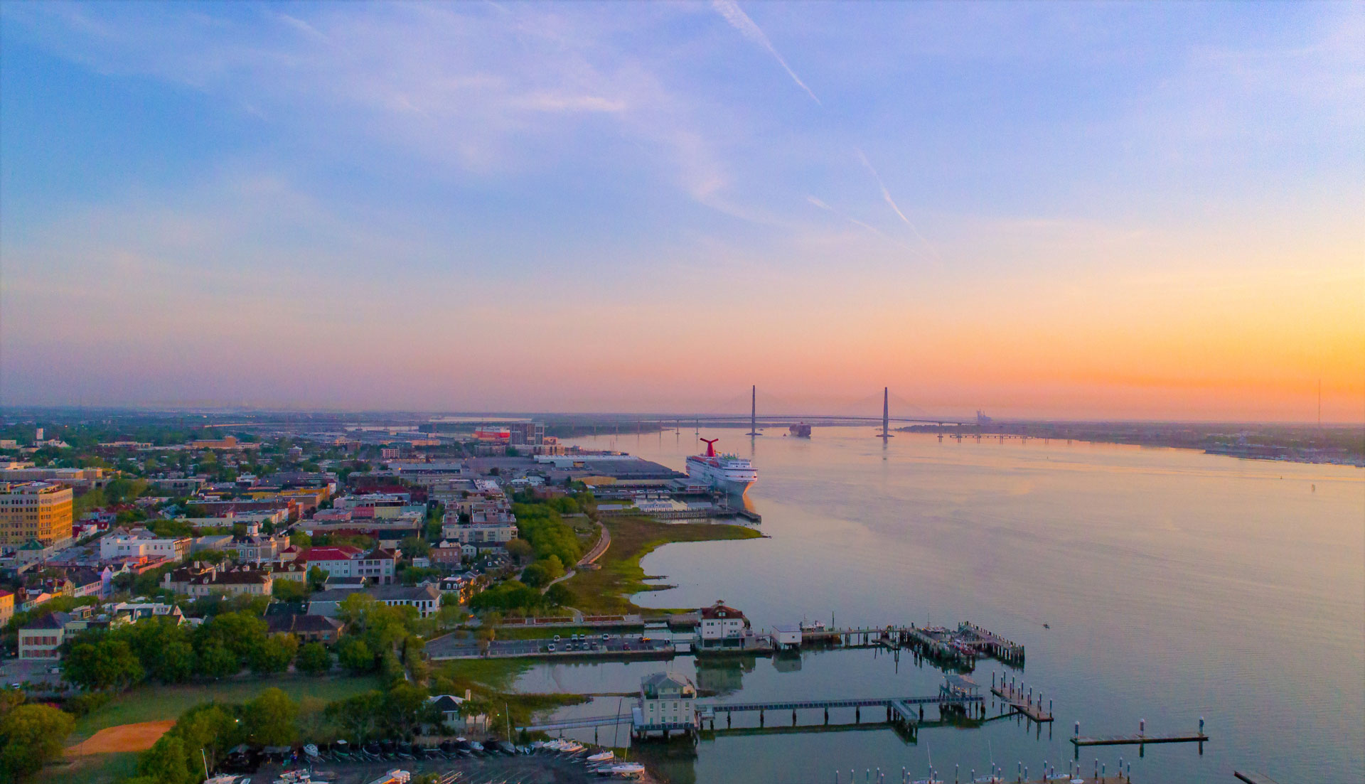 Aerial view of Charleston Harbor and Charleston Harbor Pilots station looking at bridge.